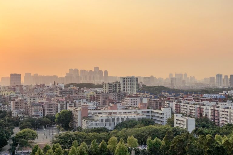 A panoramic aerial shot of the cityscape and the colorful skyline at sunset aerial