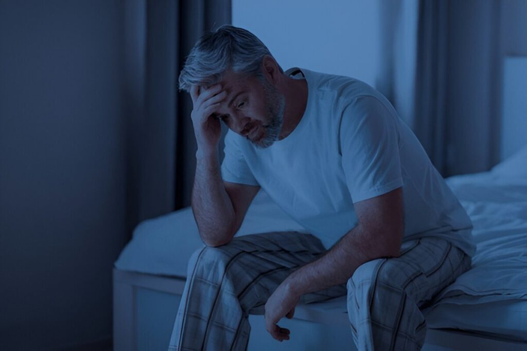 A person sitting on a bed