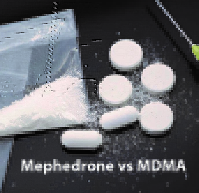 A white pills and powder next to a bag of white powder