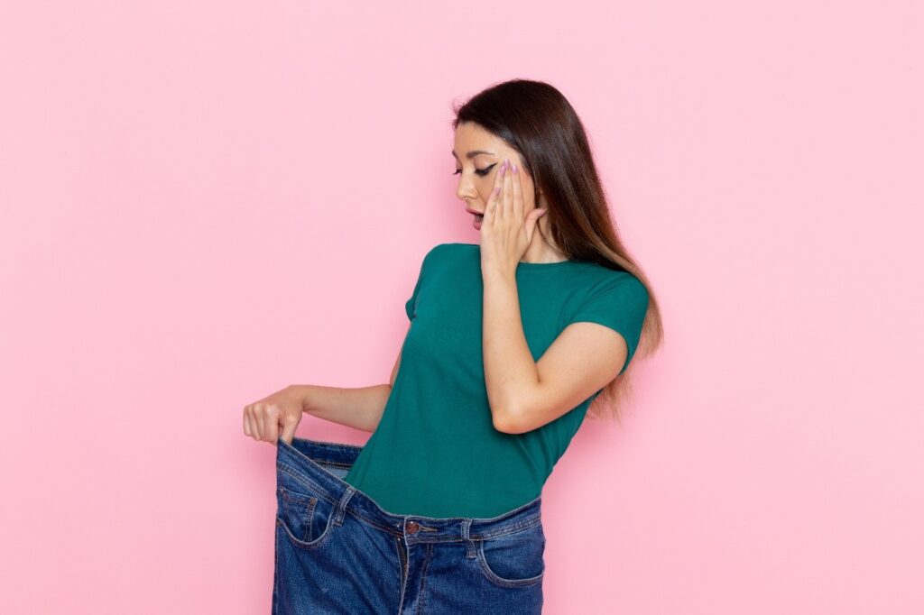 A person holding her pants