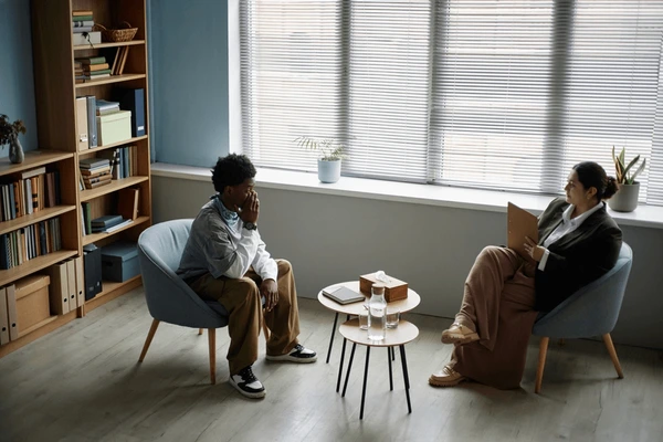 black-teenage-boy-sitting-counseling-session